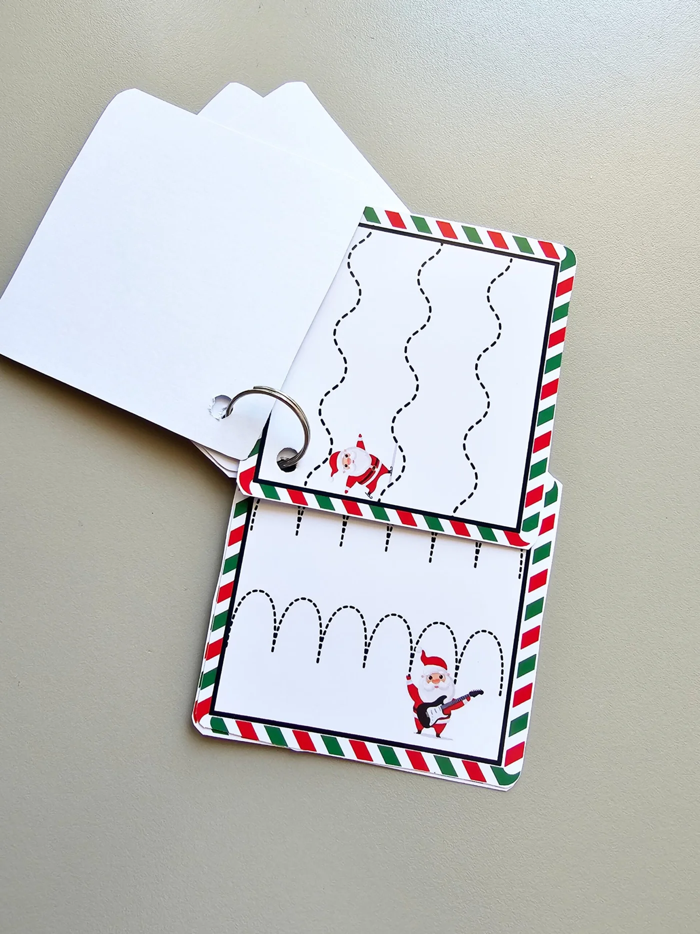 Livrinho motricidade com o Noel — amostra 1: Este PDF é um mini-livro de argolas para motricidade fina com tema de Natal ,…