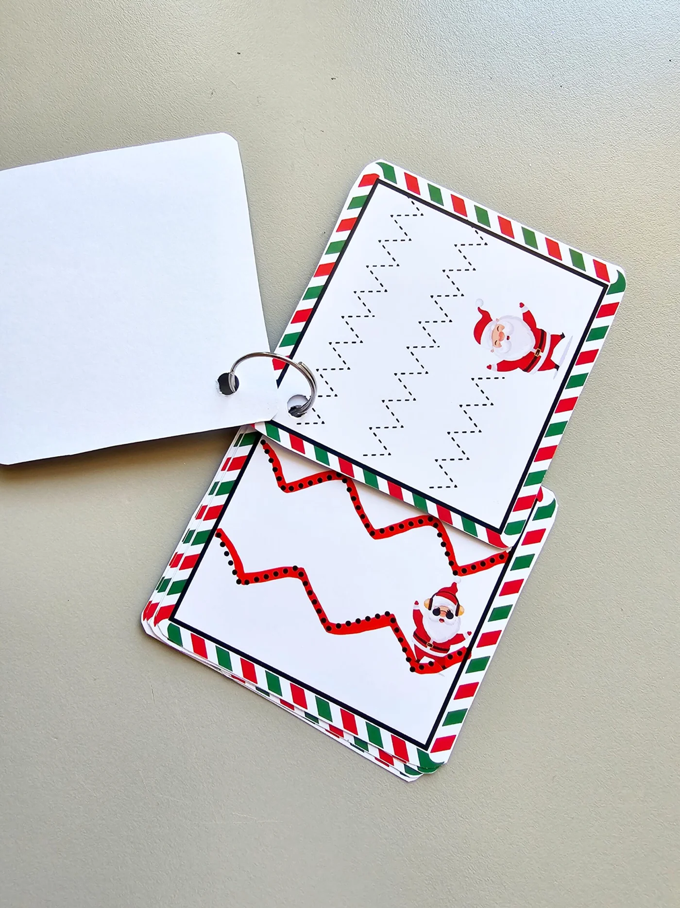 Livrinho motricidade com o Noel — amostra 2: Este PDF é um mini-livro de argolas para motricidade fina com tema de Natal ,…