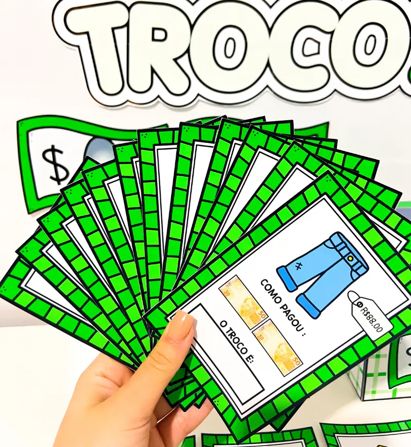 Qual é o Troco? | PDF Matemática Anos Iniciais — amostra 3: Contém fichas com diferentes produtos, preços e formas de…