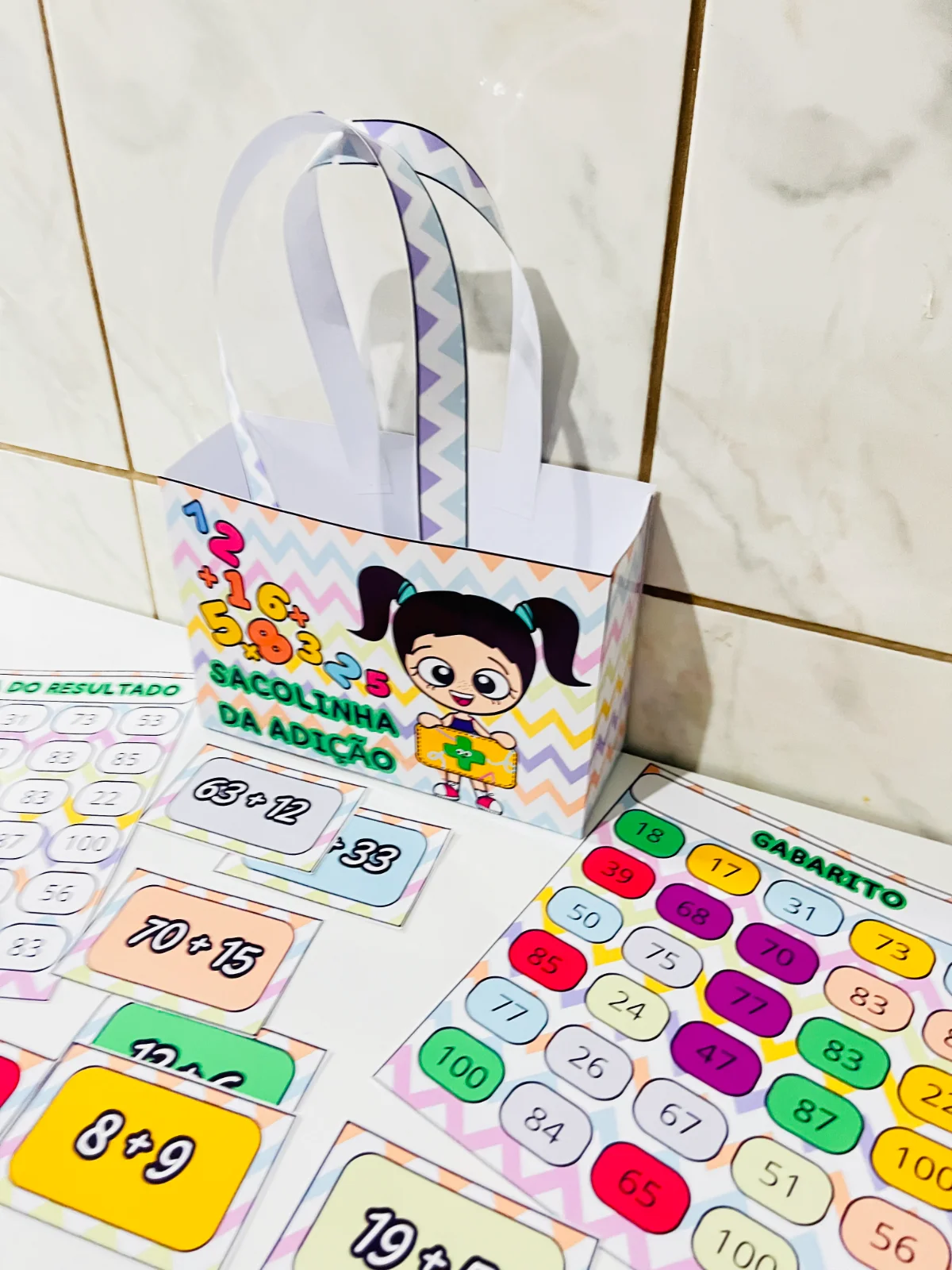 Sacolinha da Adição Divertida – 30 Cards para Trabalhar Adição — amostra 1: Recurso lúdico com 30 cards de adição e prancha…